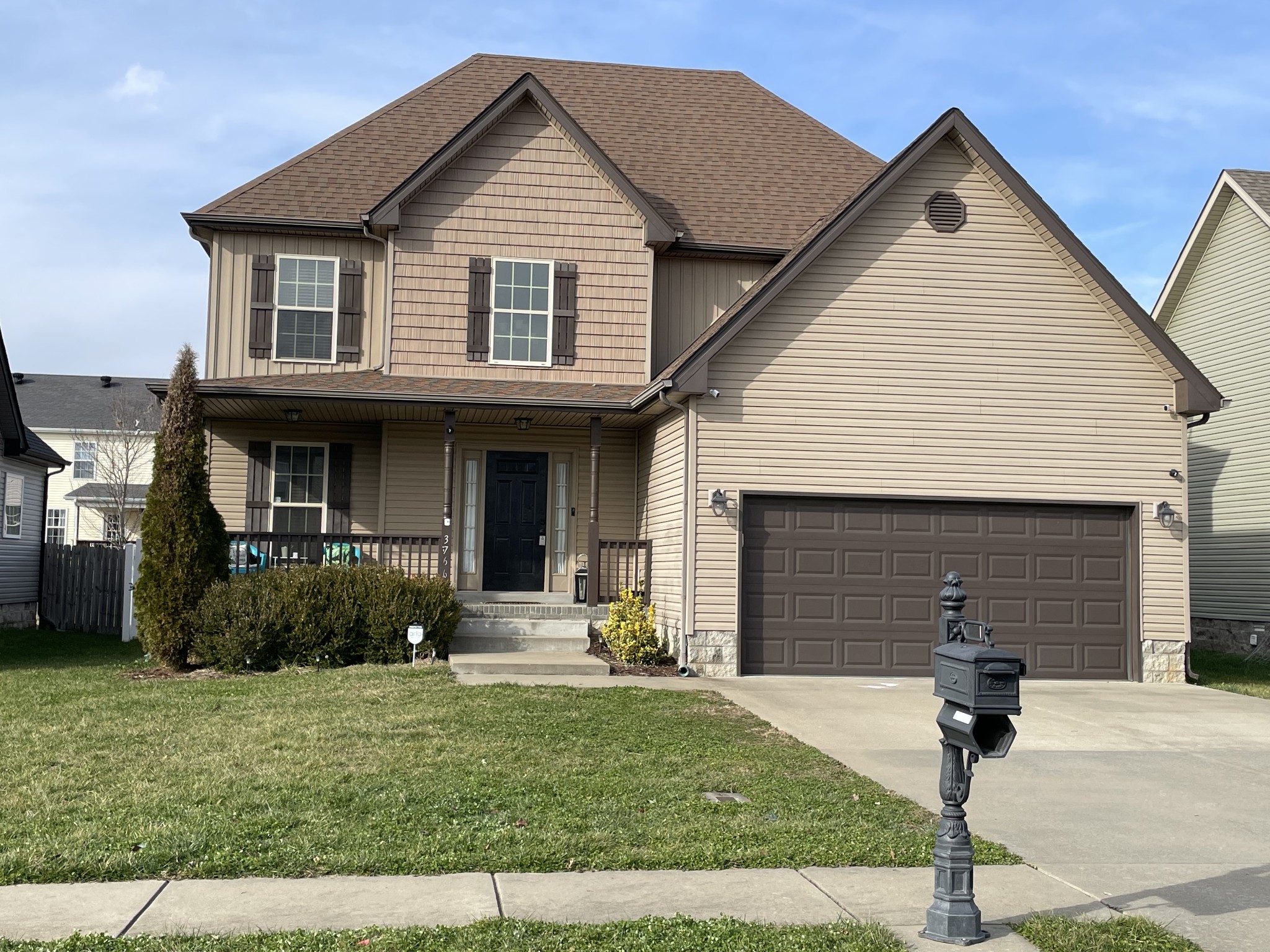 a front view of a house with garage