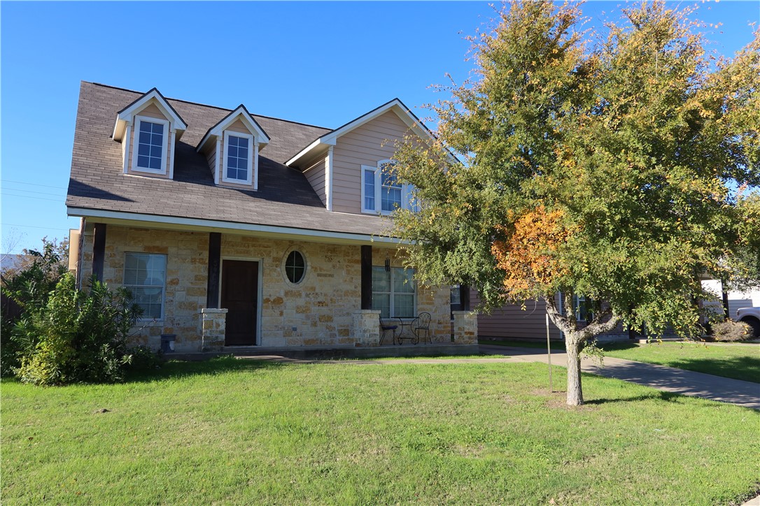 front view of a house with a yard