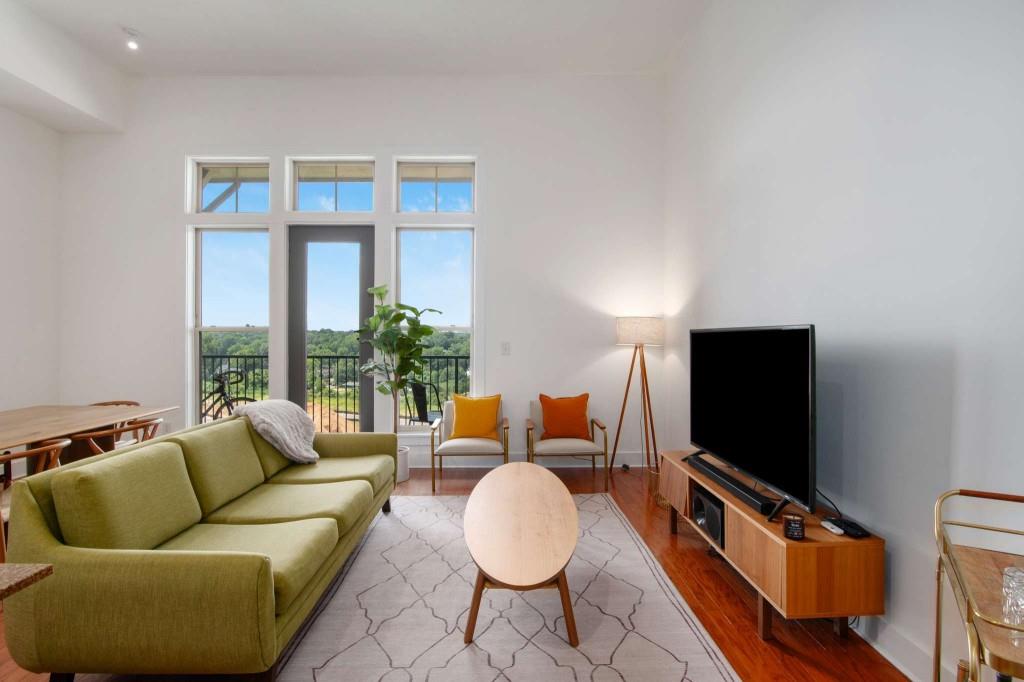 a living room with furniture and a flat screen tv