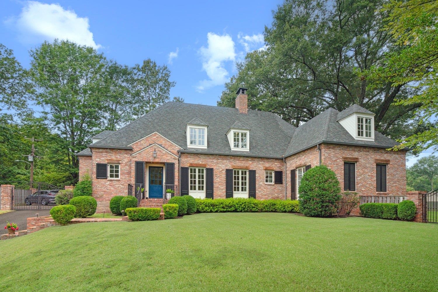 front view of a house and a yard