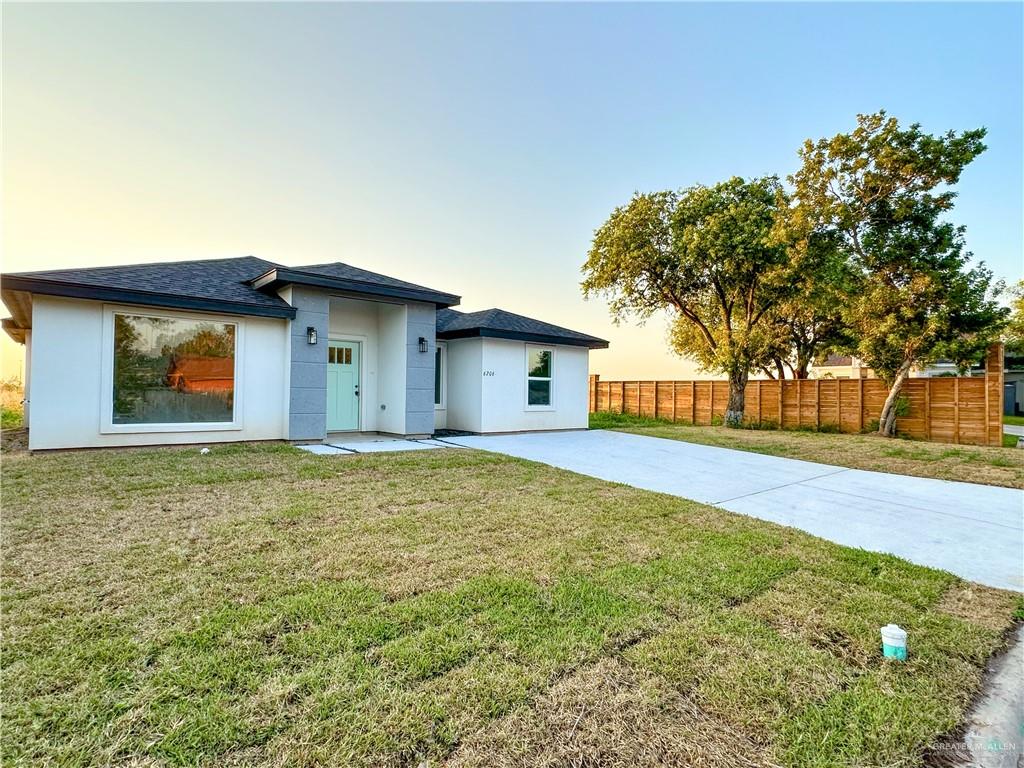 View of front of home featuring a yard.