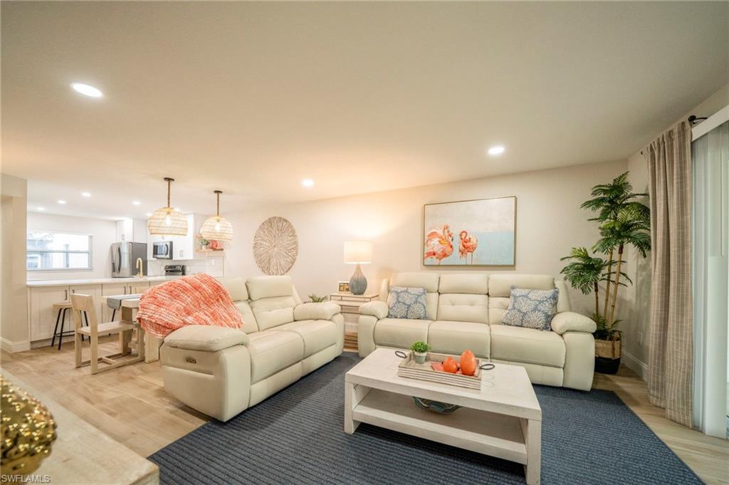 Living room with light wood-type flooring