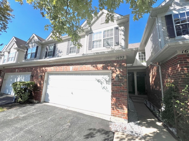 a front view of a house with a garage