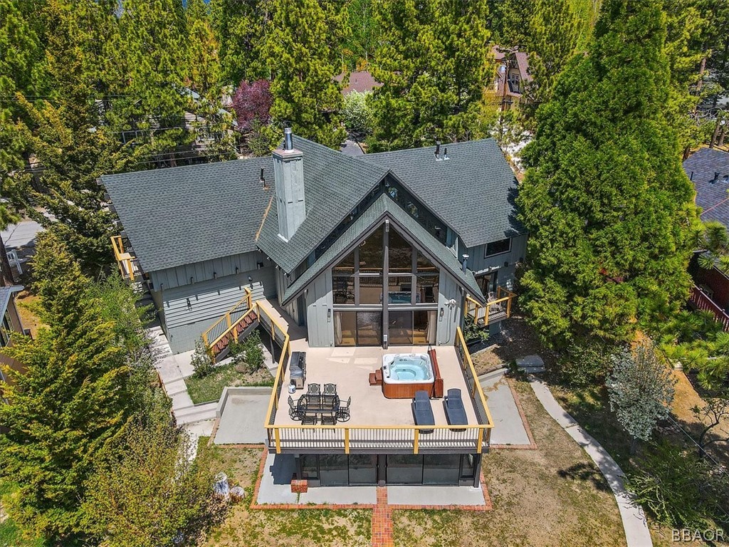 a view of house with a yard