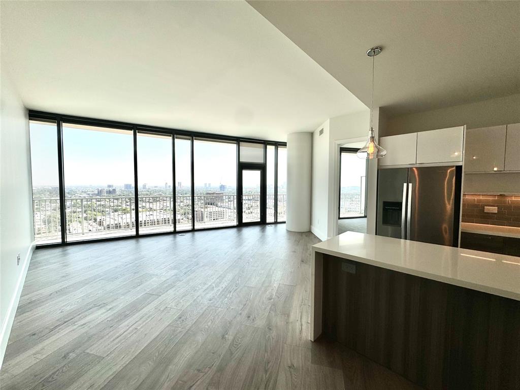 a view of a kitchen with large windows