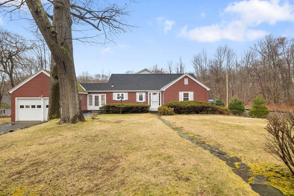 a house with a large tree in front of it