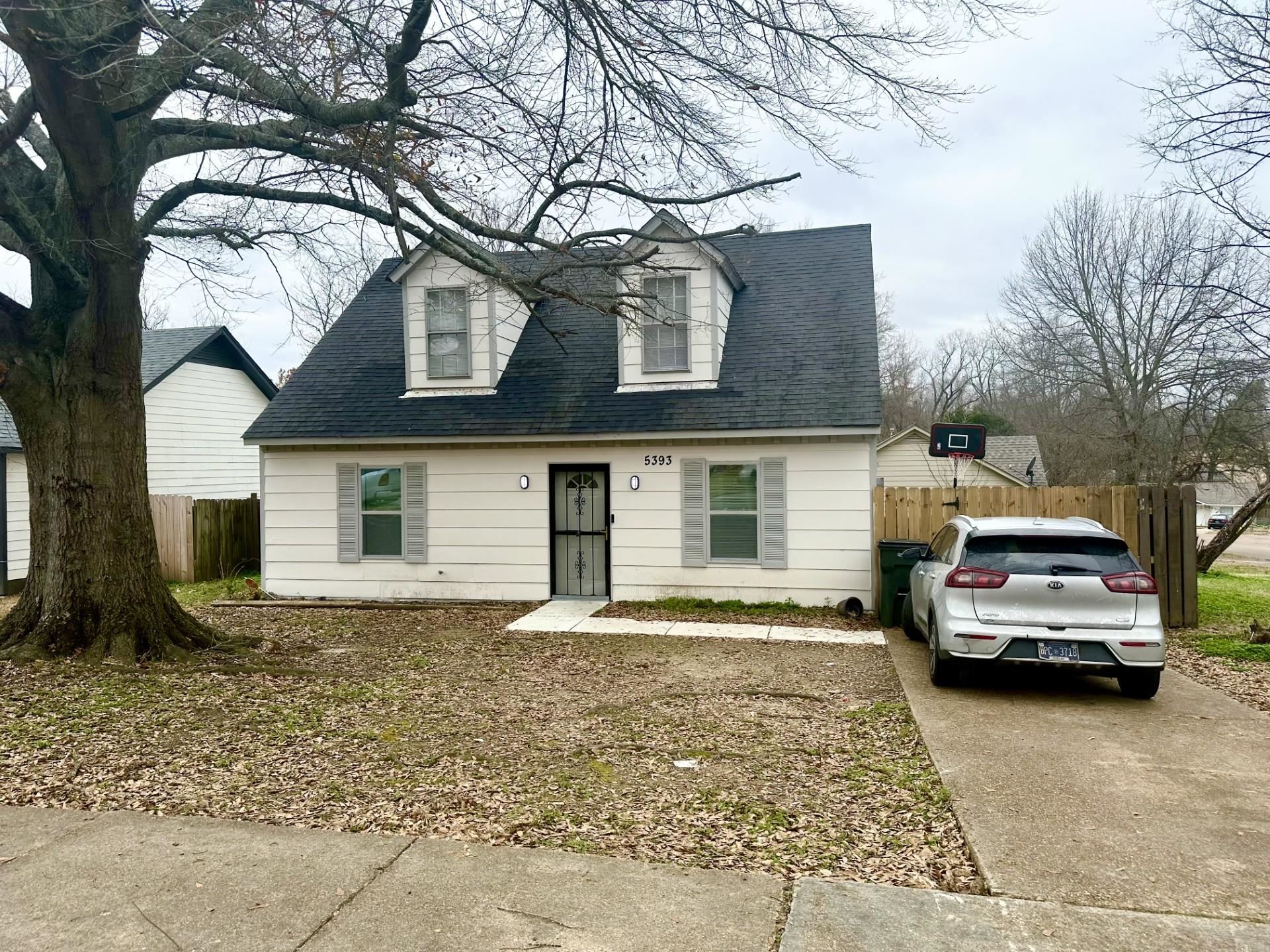 a car parked in front of a house