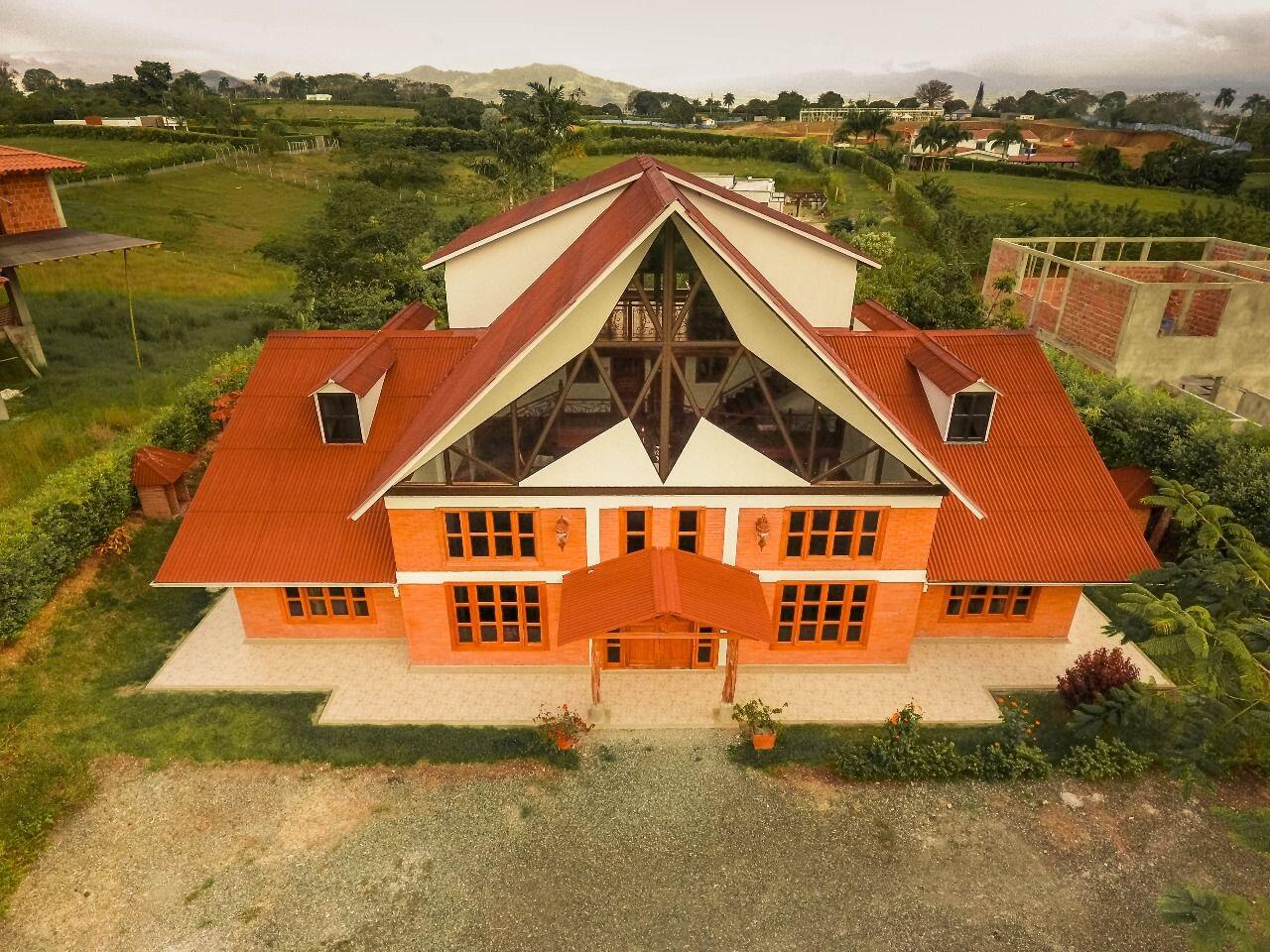 an aerial view of house with lake view