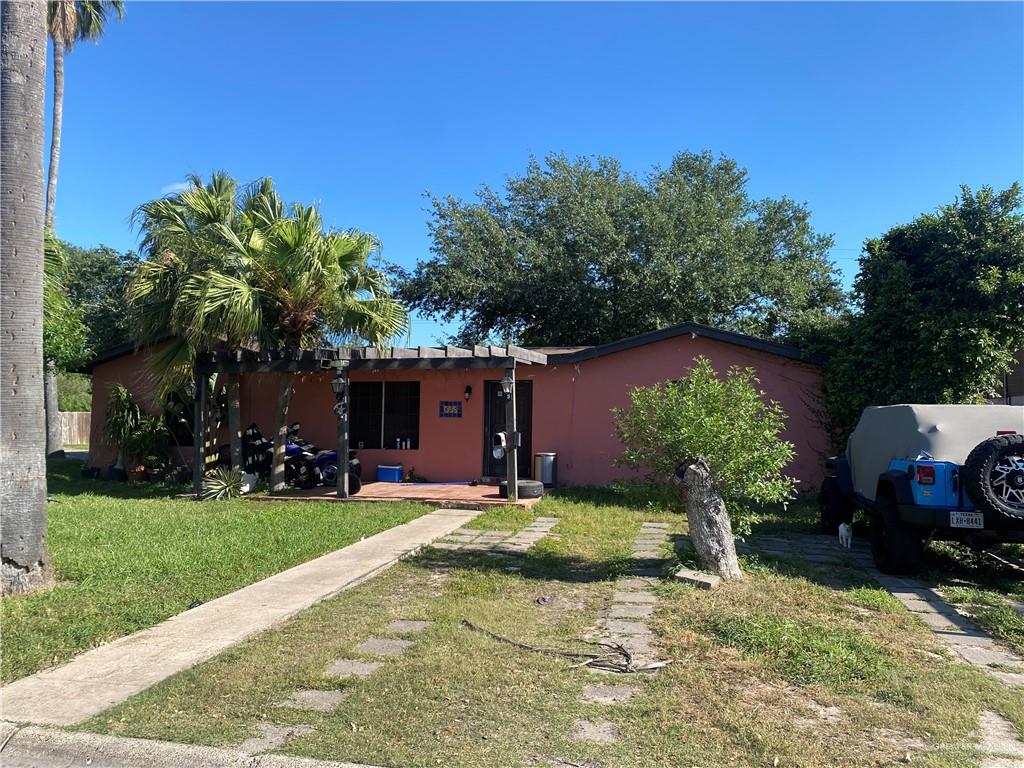 View of front of property with a front yard