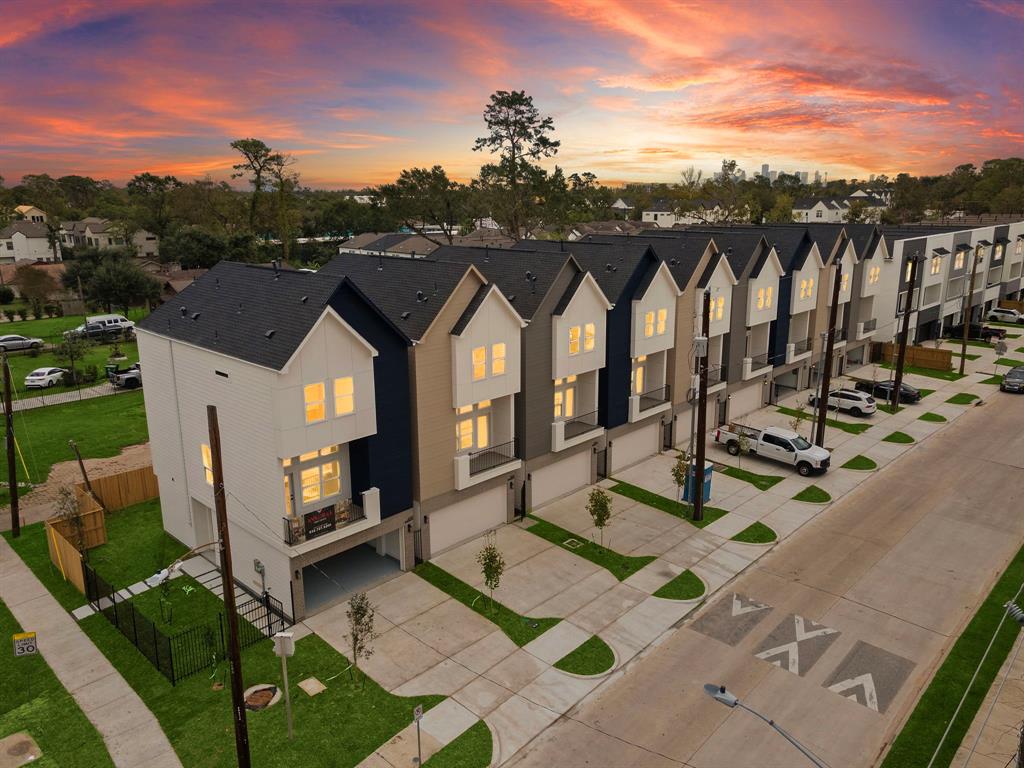 a view of houses with a lot of trees