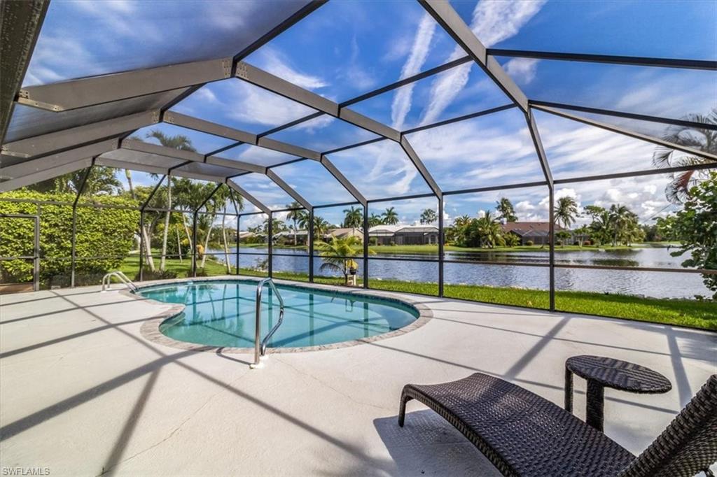 a view of a backyard with swimming pool