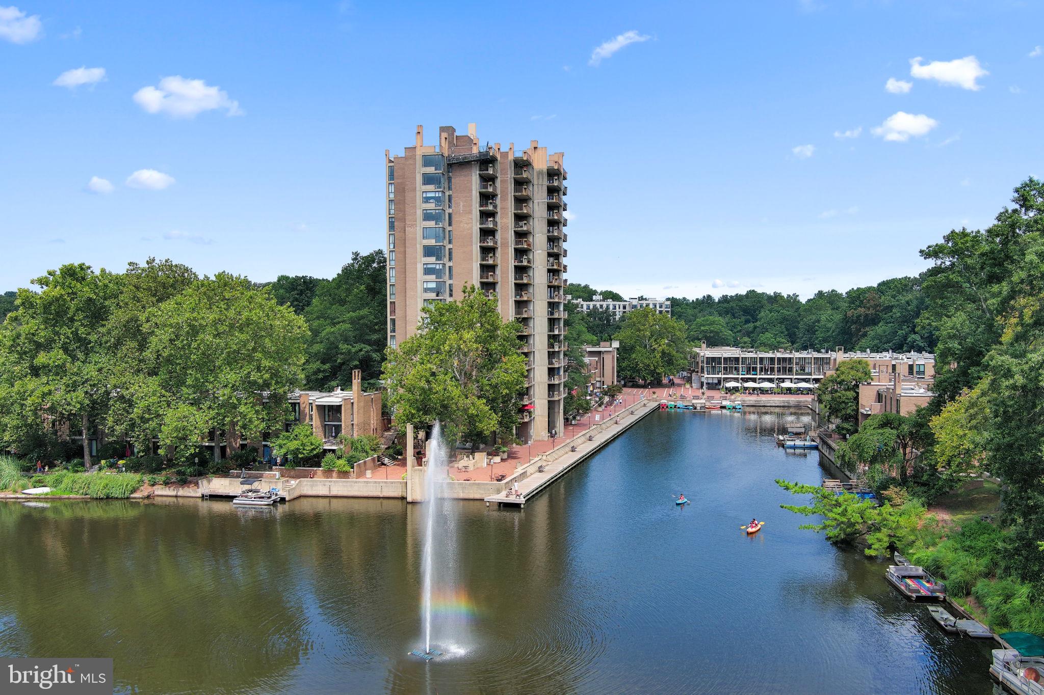 a view of a lake with tall building