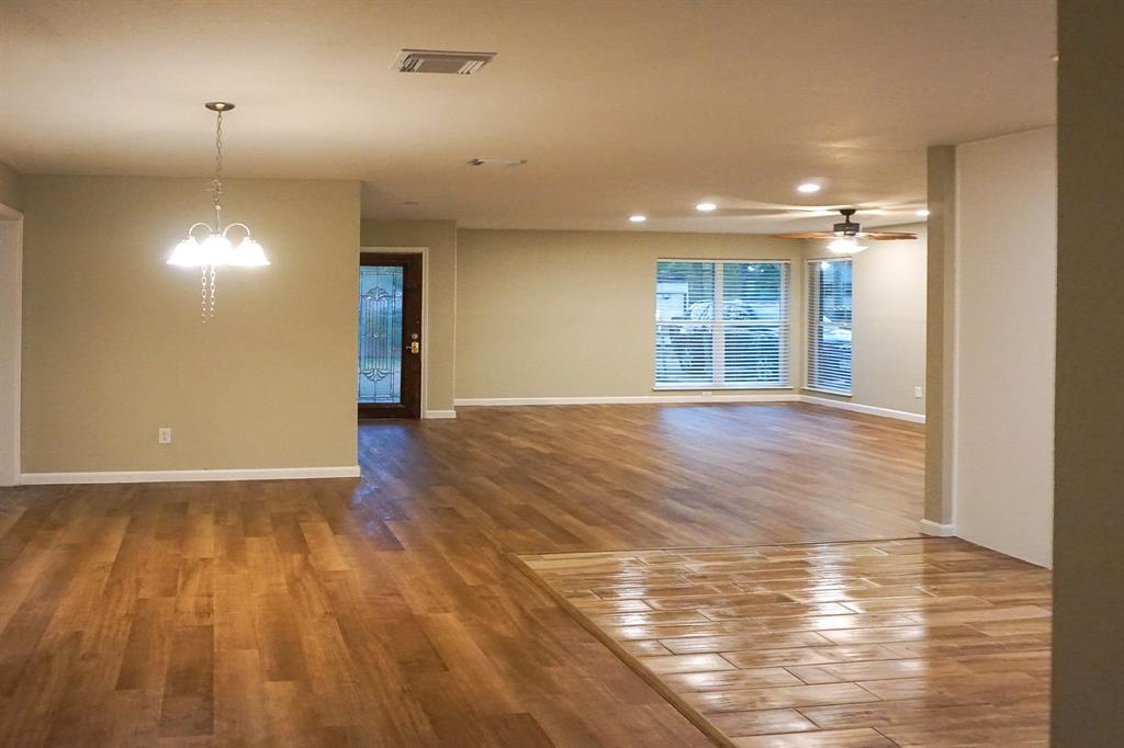 a view of an empty room and a window