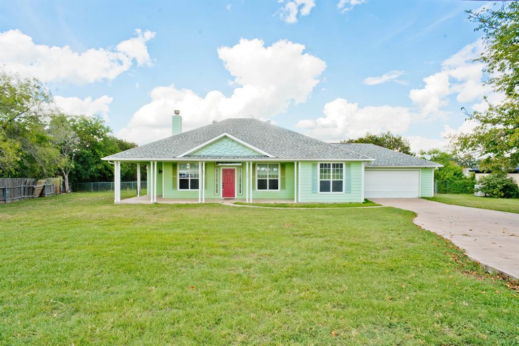 a front of a house with a garden