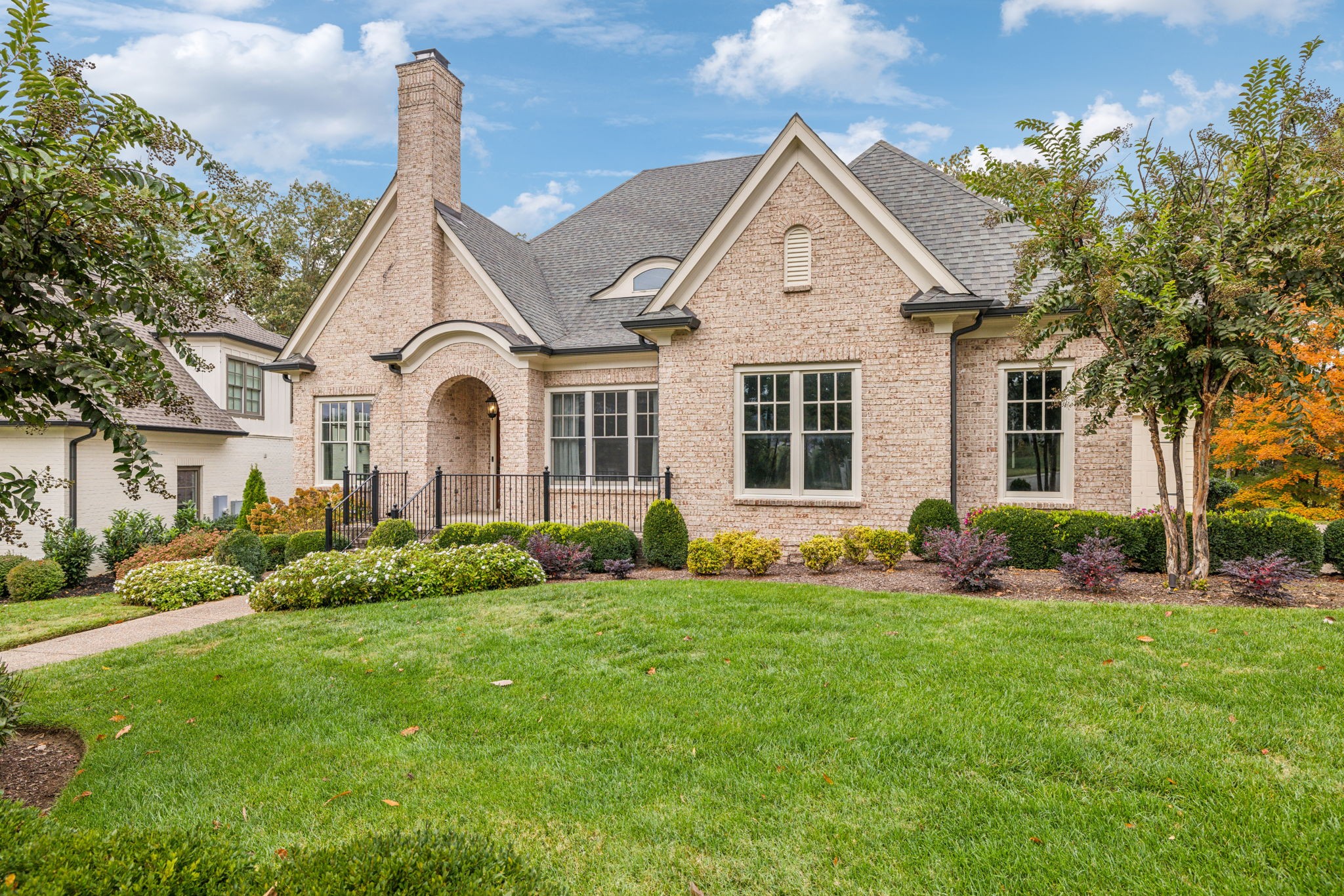 a front view of a house with a yard