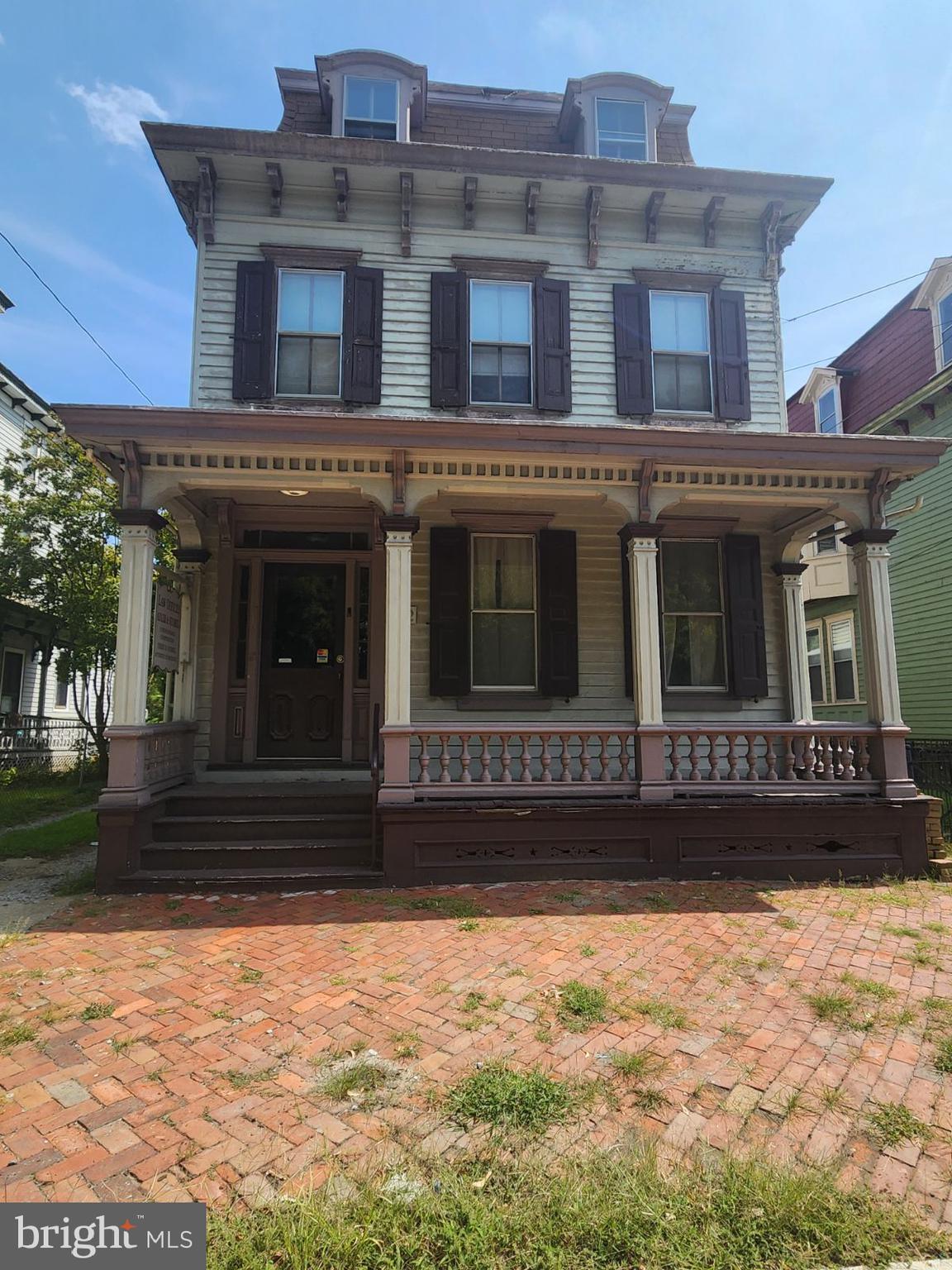 a view of a building with a yard