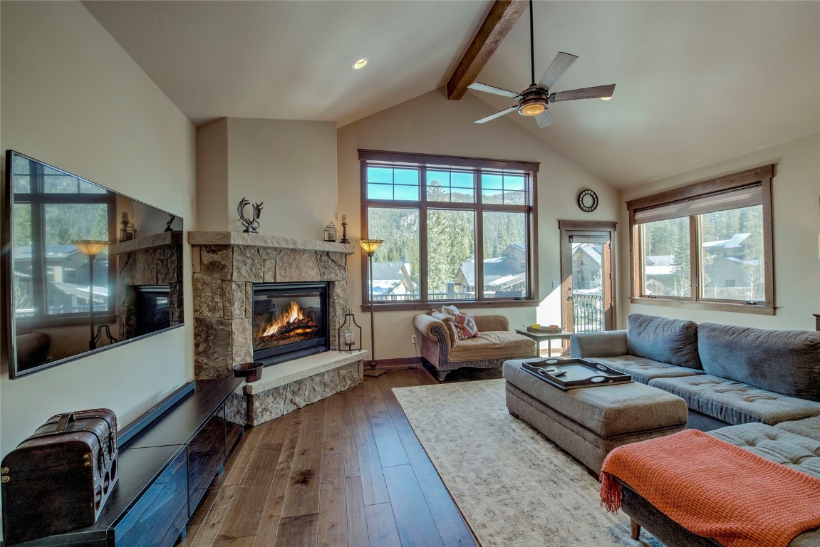 a living room with furniture fireplace and flat screen tv