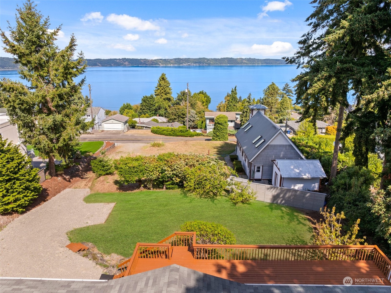 a view of a lake with a house in a background