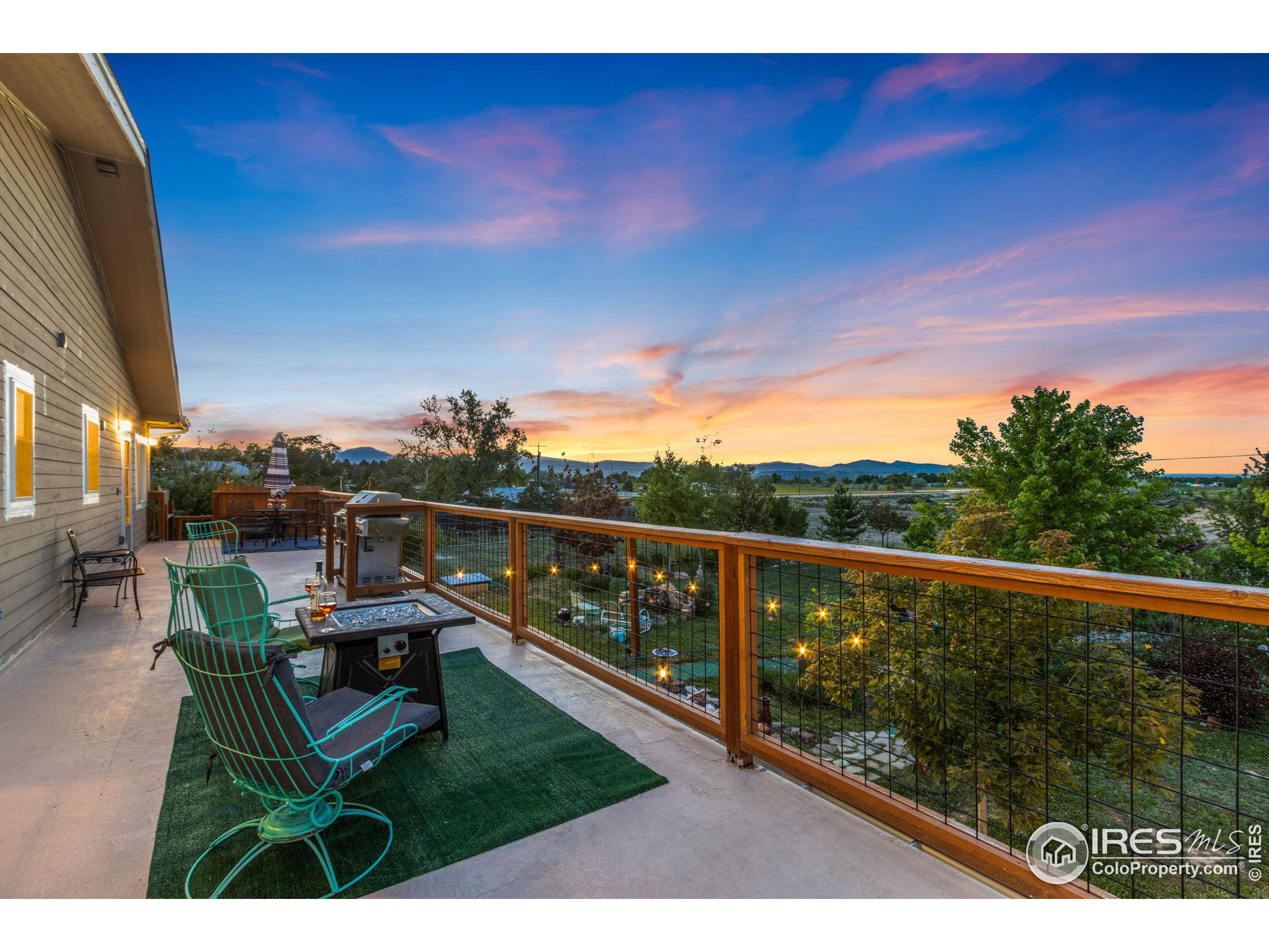 a view of a chairs and table in patio