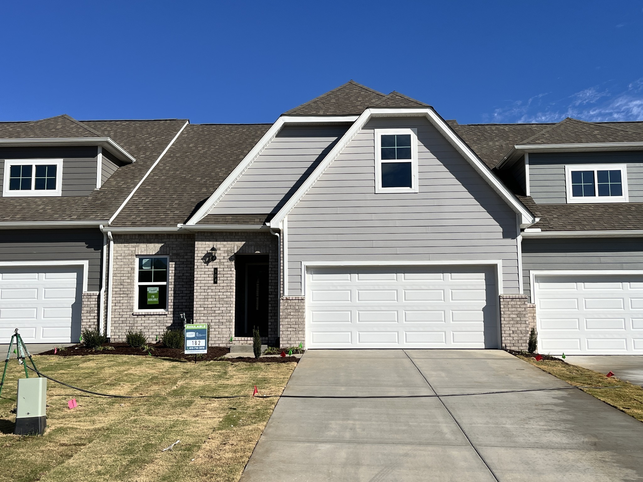 a front view of a house with a garage