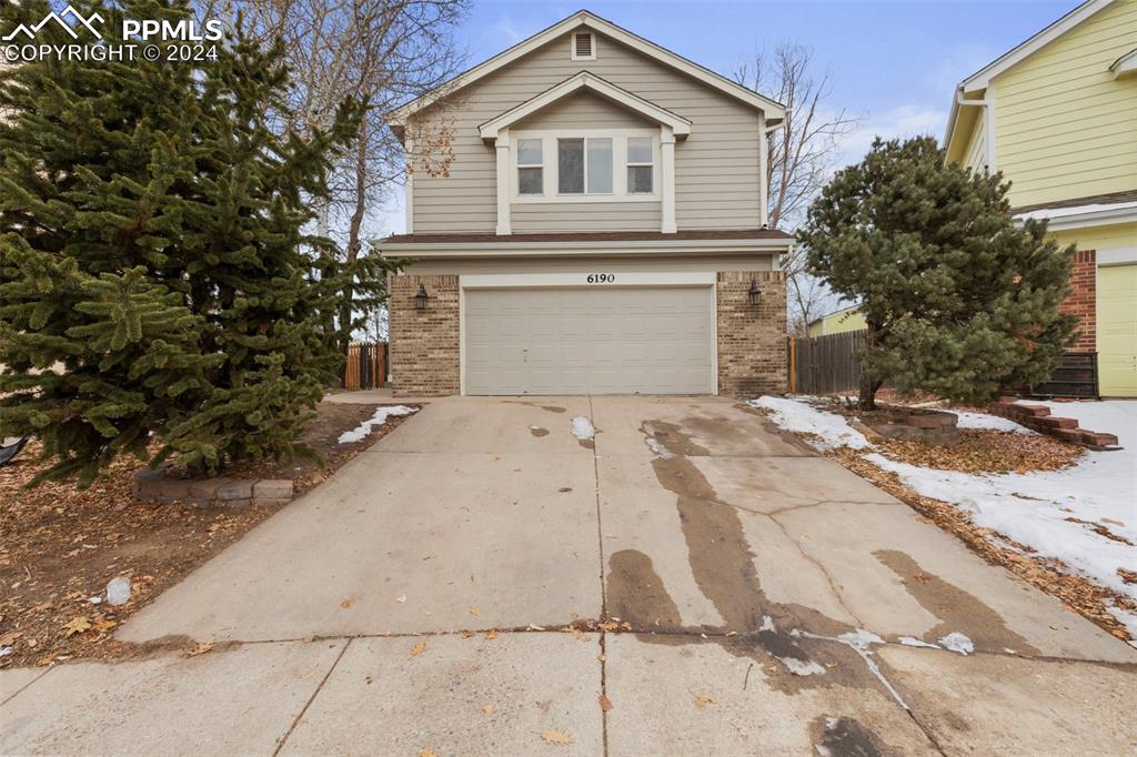 View of property with a garage