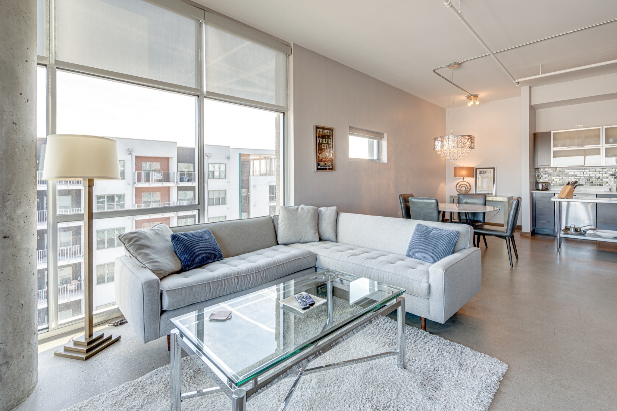 a living room with furniture and a large window