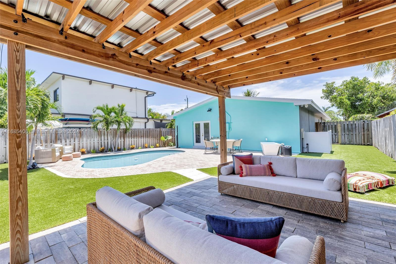 a living room with furniture and a swimming pool