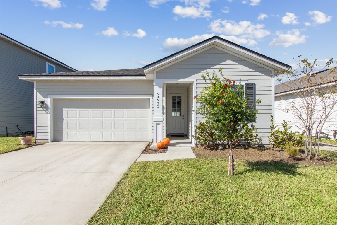 a front view of house with a yard