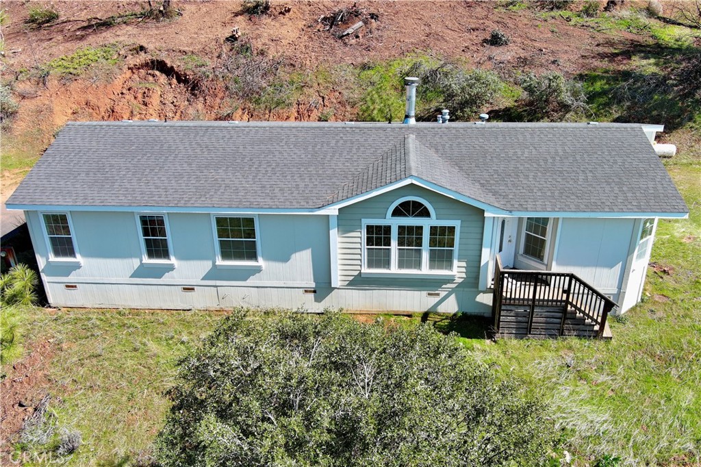 a front view of house with yard and seating area