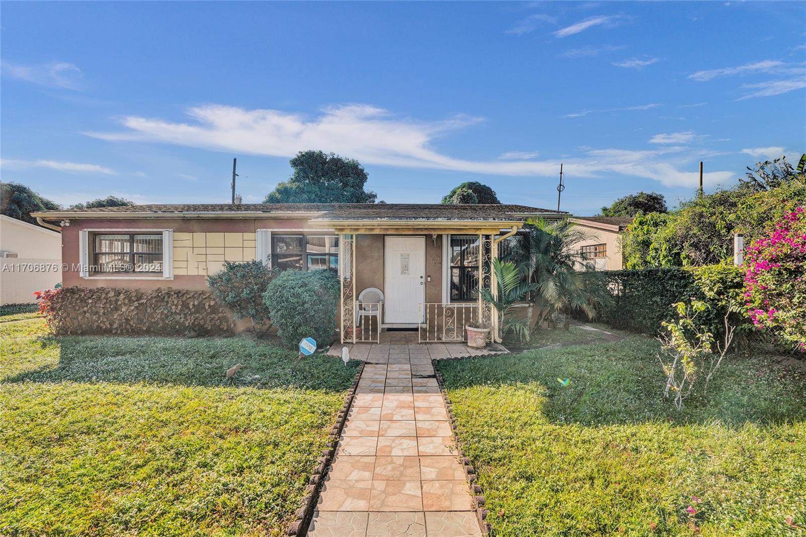 front view of a house with a yard