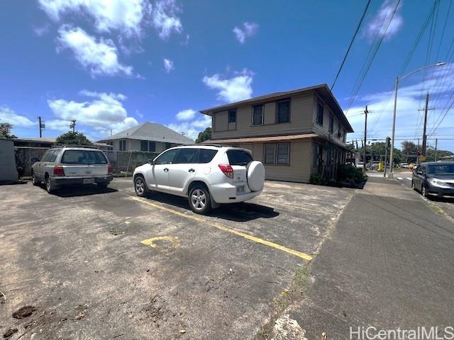 a view of street with parked cars