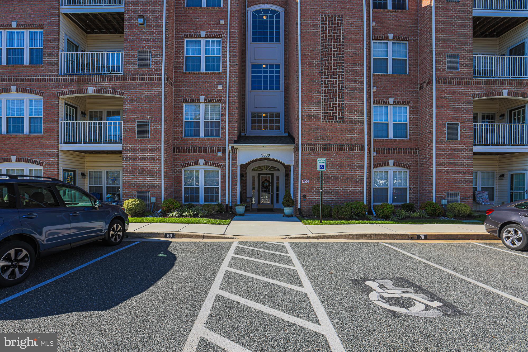 a front view of a building with a yard