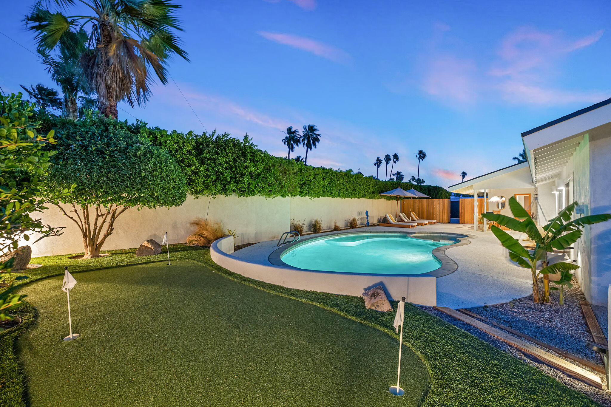 a swimming pool with an outdoor seating