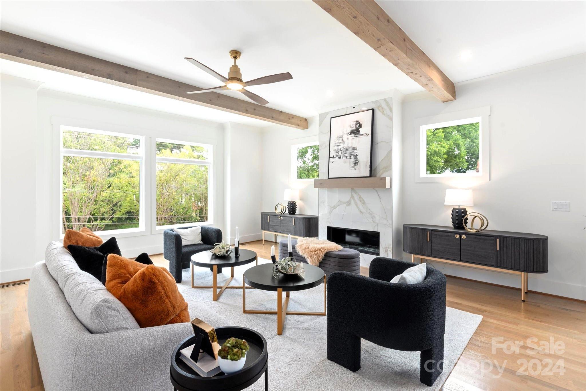 a living room with furniture and a fireplace