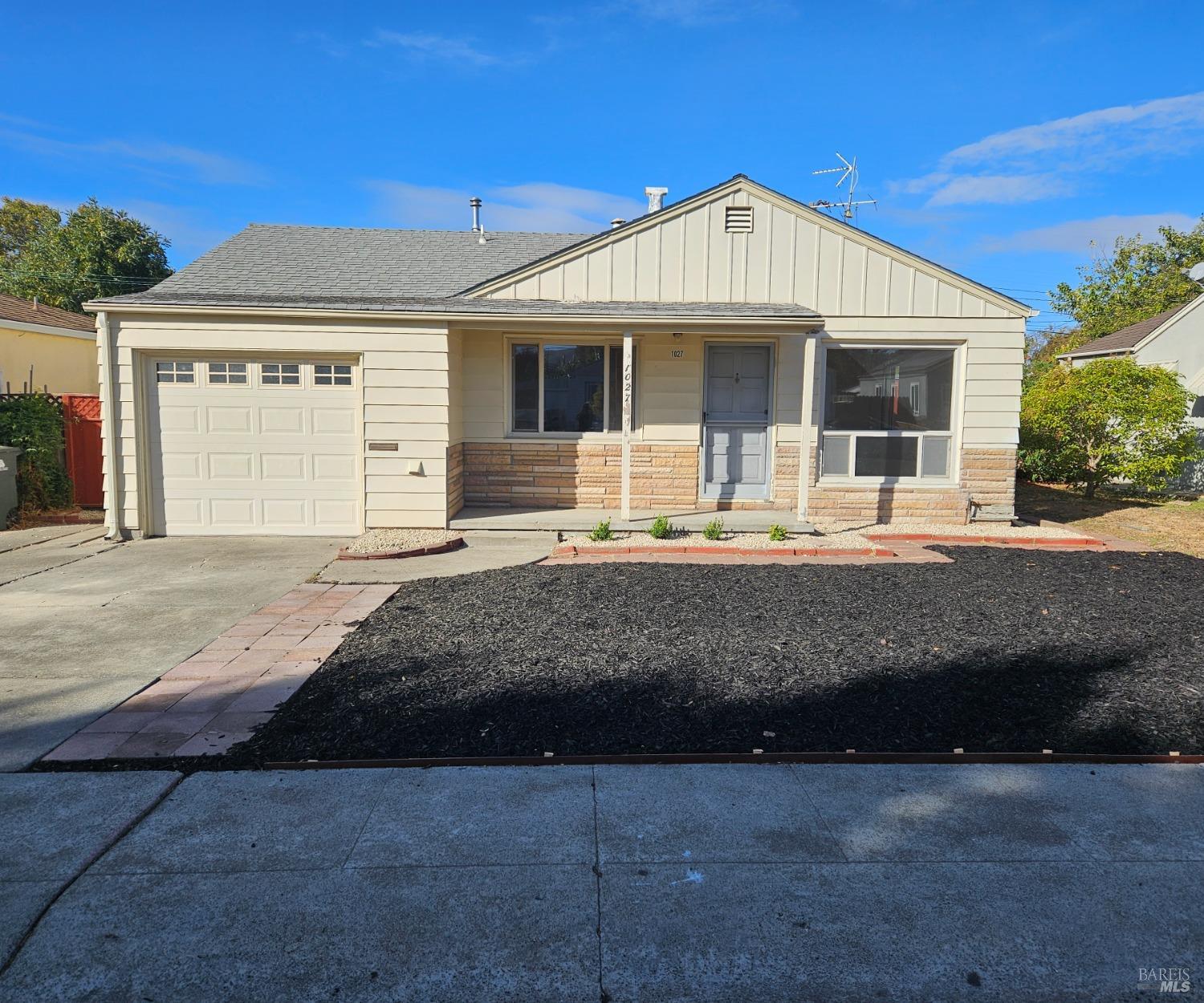 a front view of a house with a outdoor space