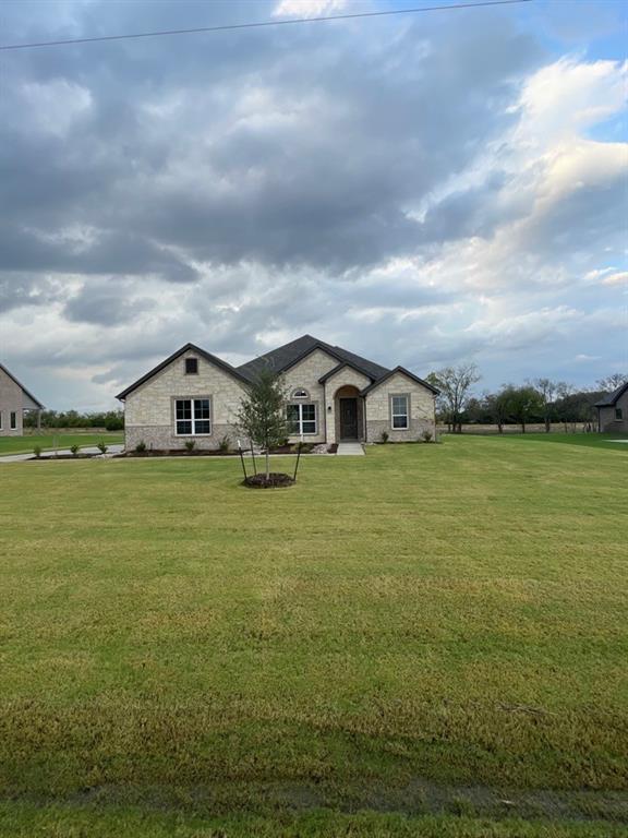 a house view with swimming pool in front of it