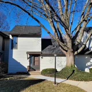 a front view of a house with garage