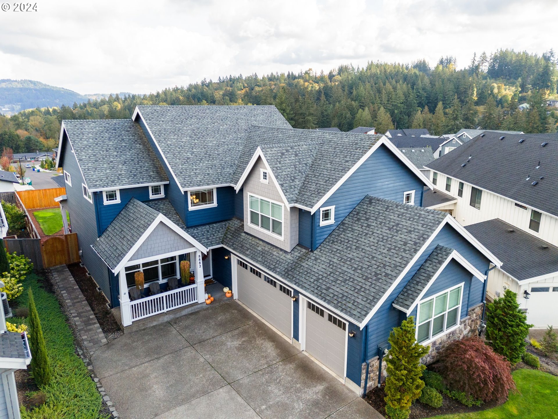 a aerial view of a house with a yard