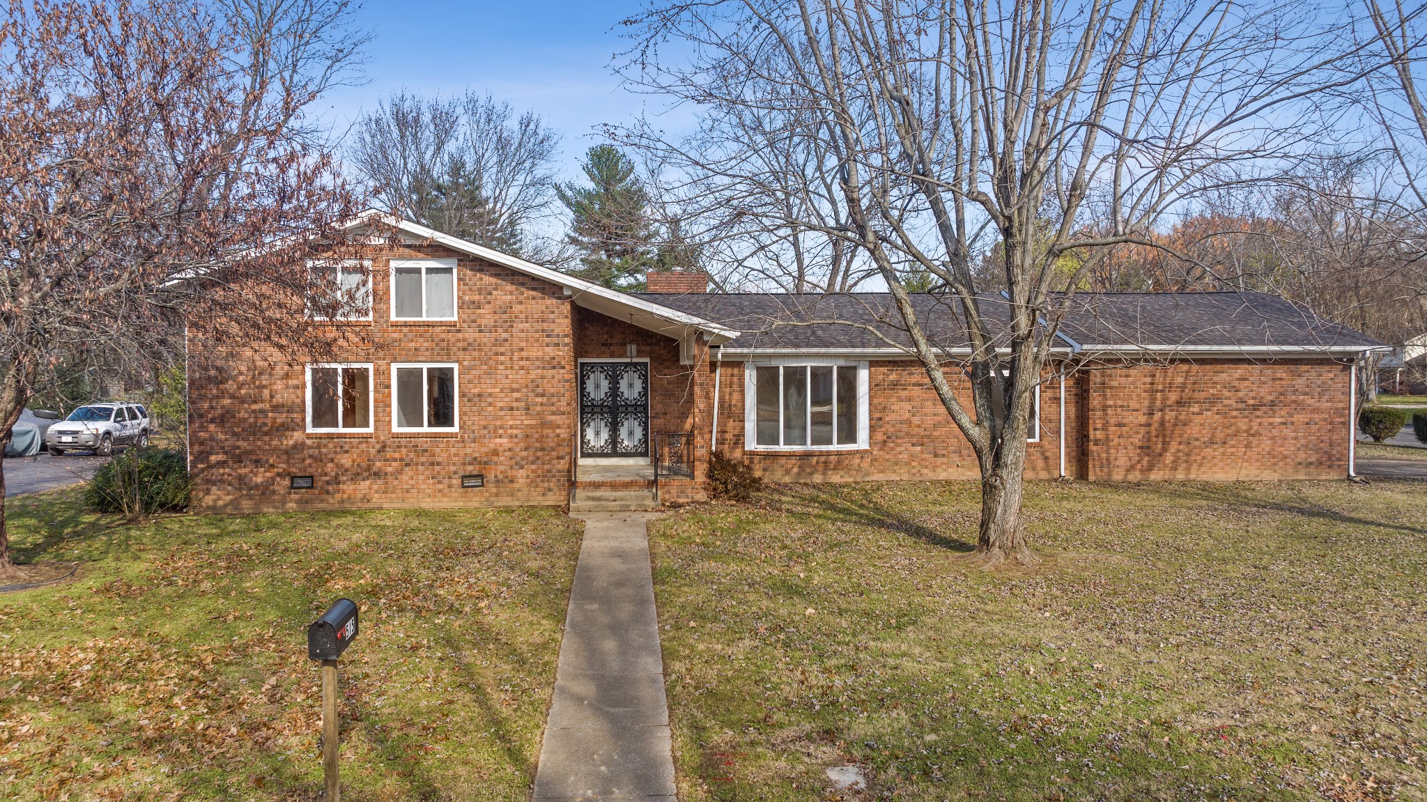 a front view of a house with a yard