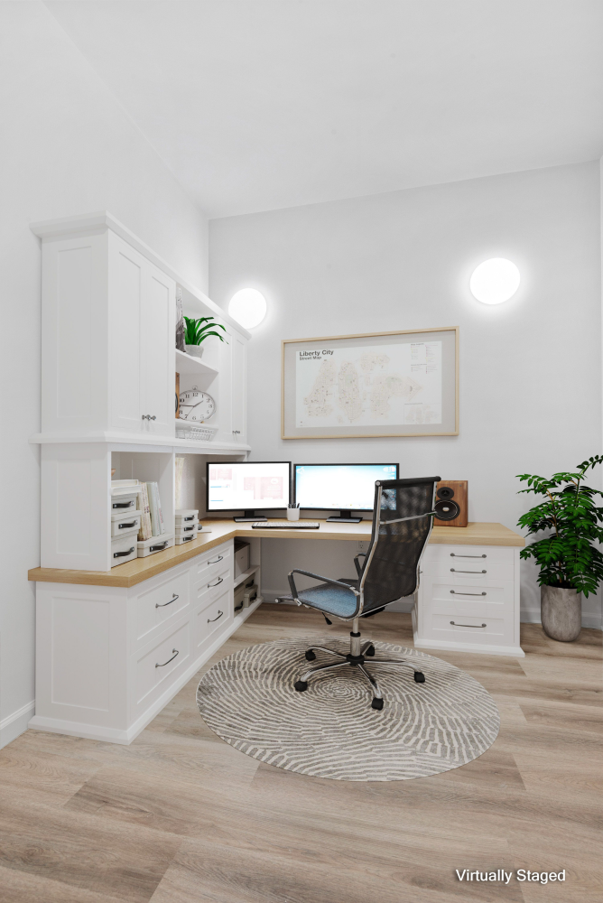 a living room with furniture kitchen view and a potted plant