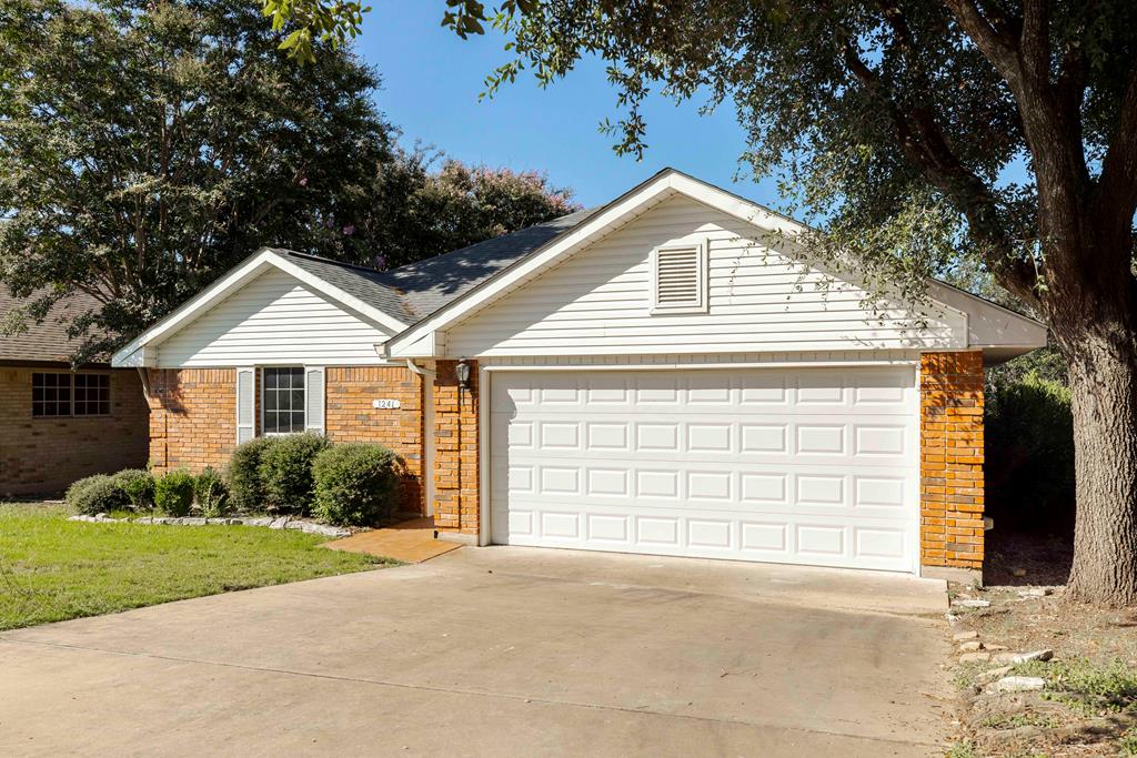 a view of outdoor space yard and garage