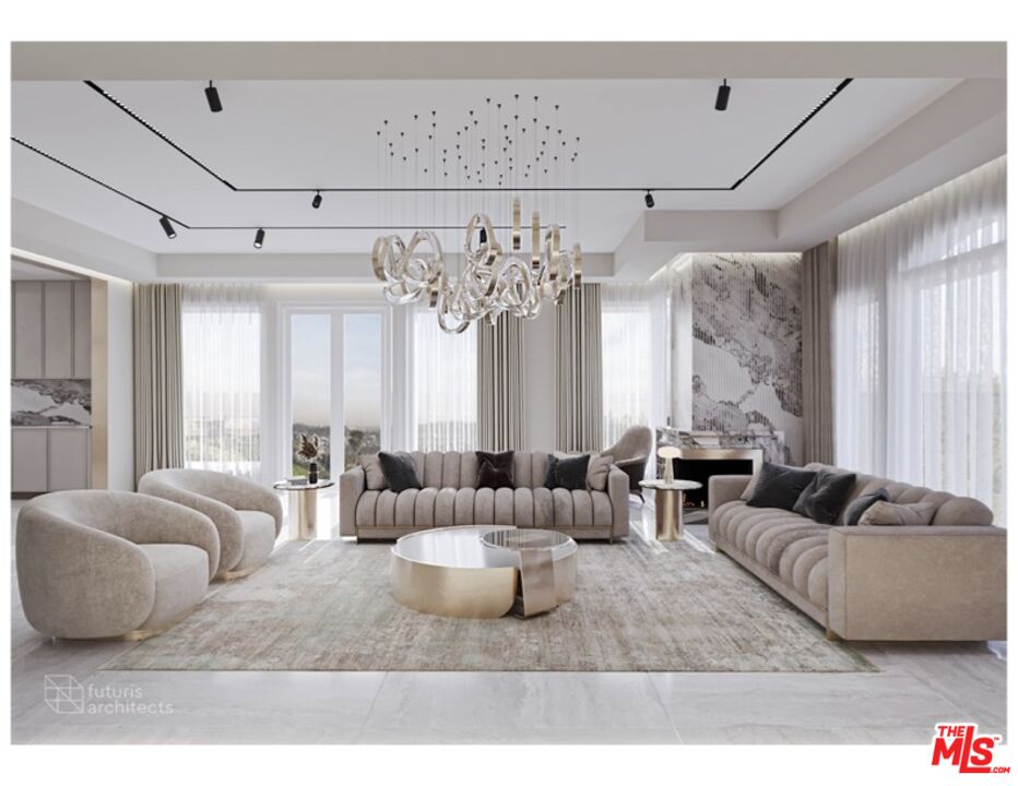 a living room with furniture and a chandelier