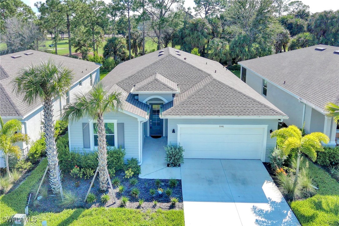 a aerial view of a house with yard and plants