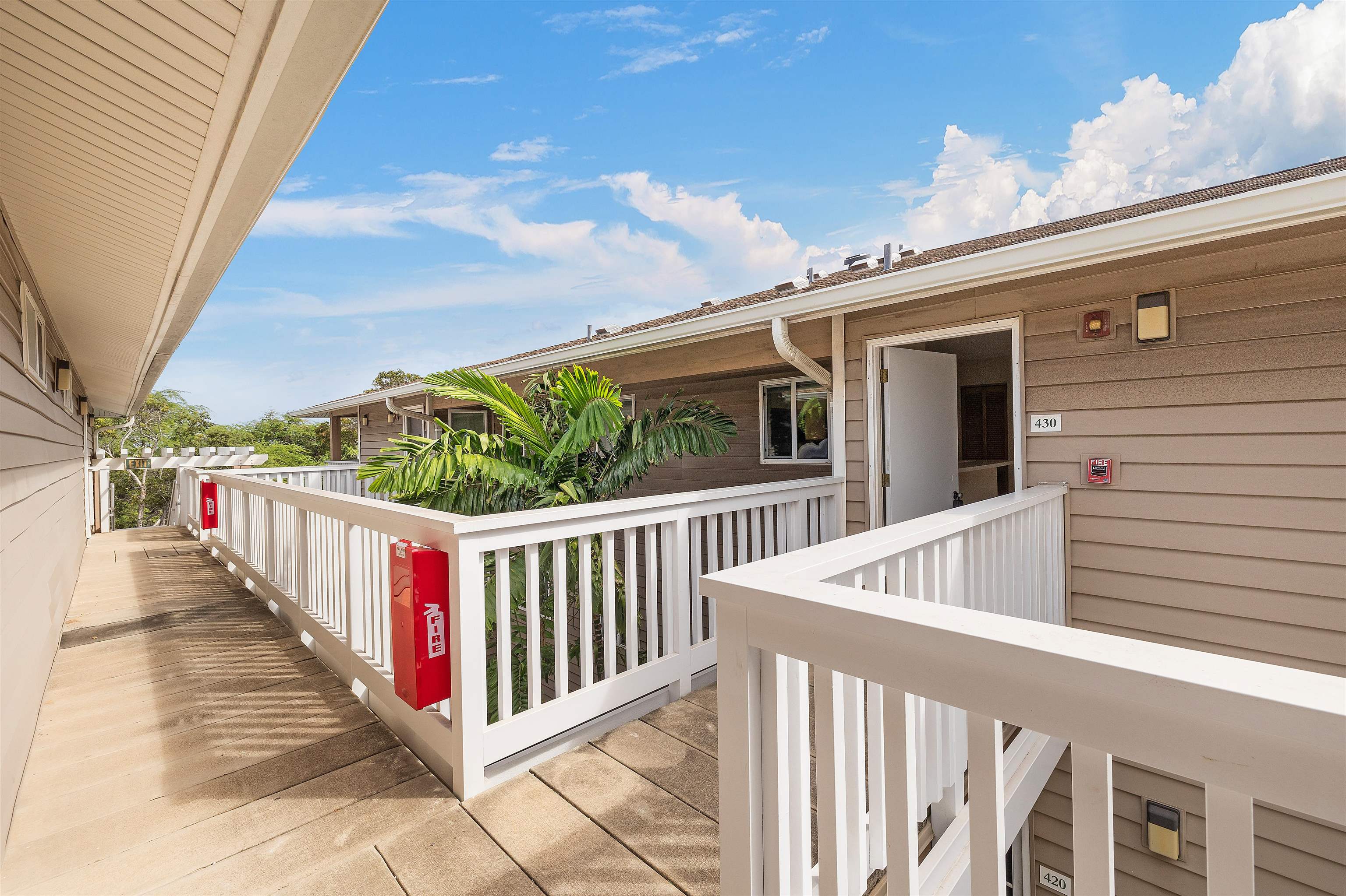 a view of a balcony with wooden floor