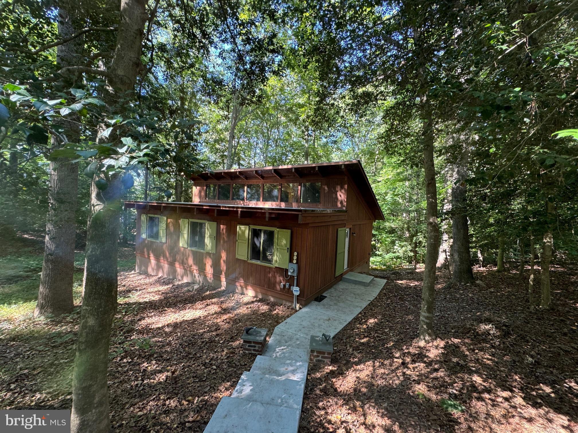 a view of a wooden deck with a yard