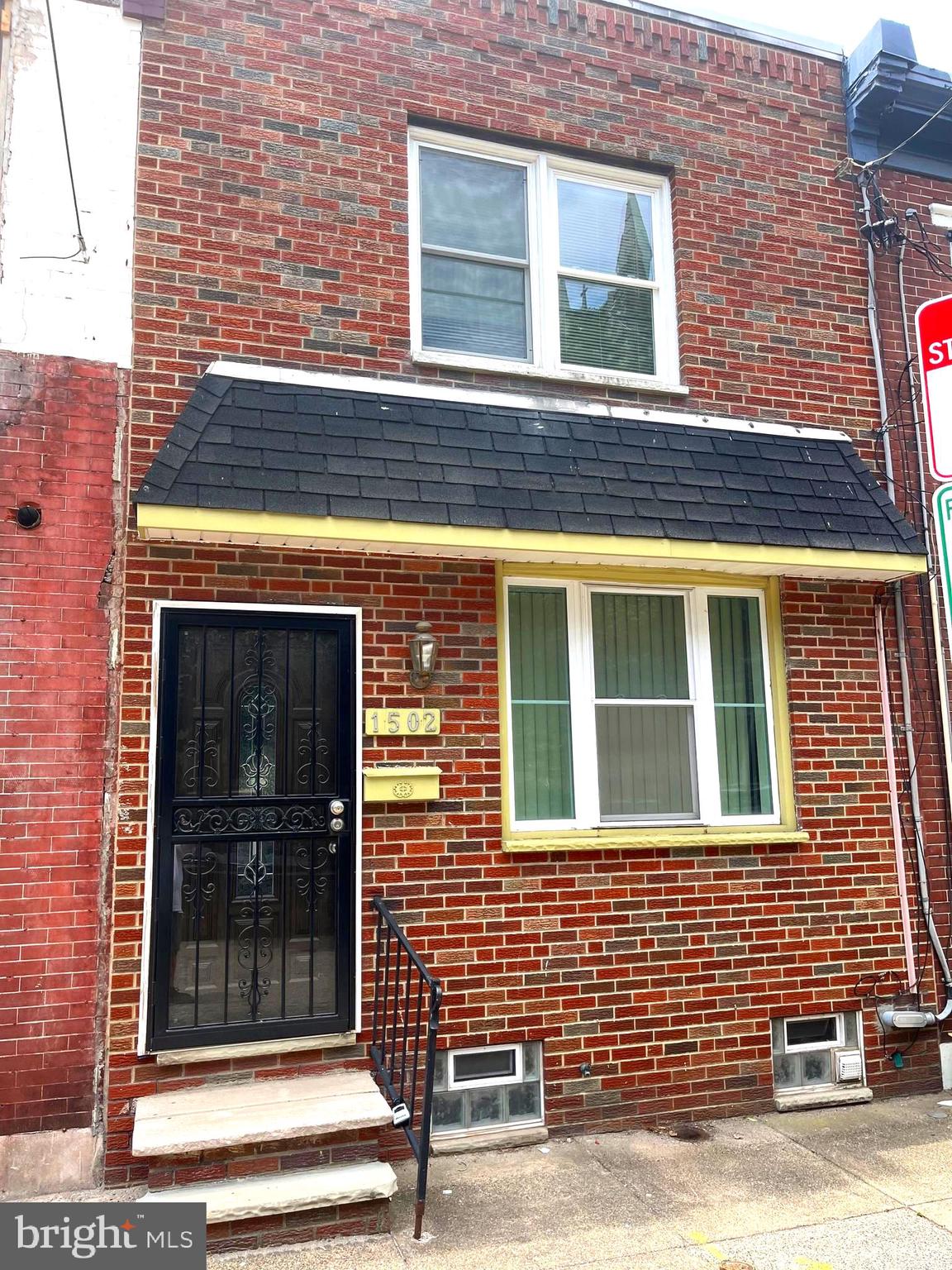 a view of brick building with a door