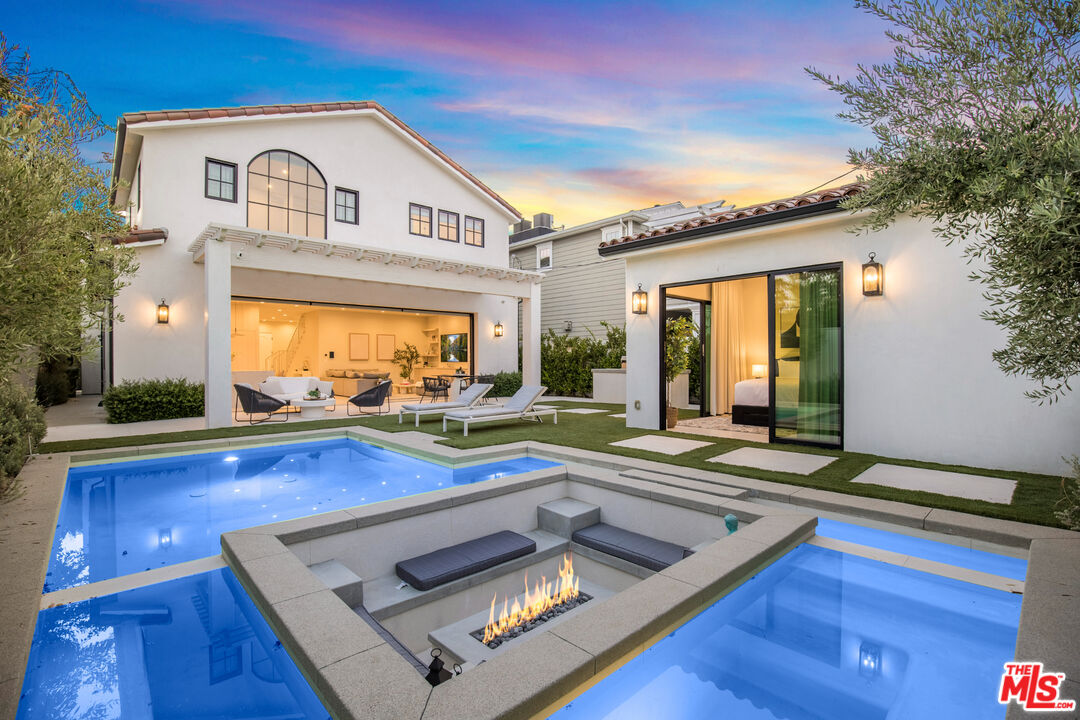 a view of a house with pool and wooden floor