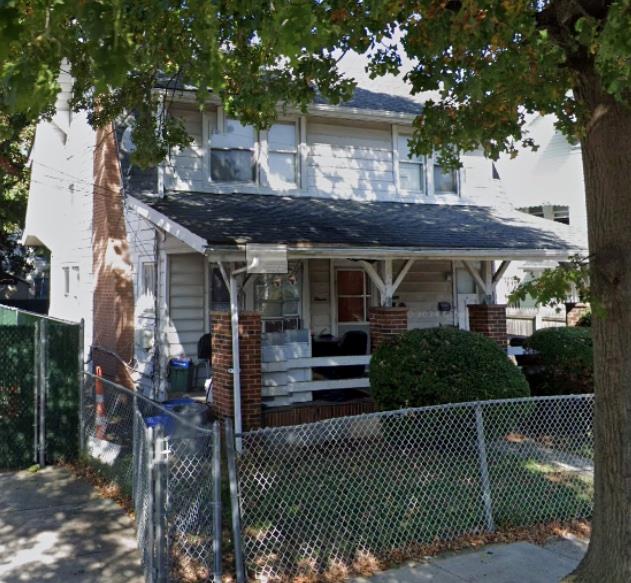 View of property with a porch