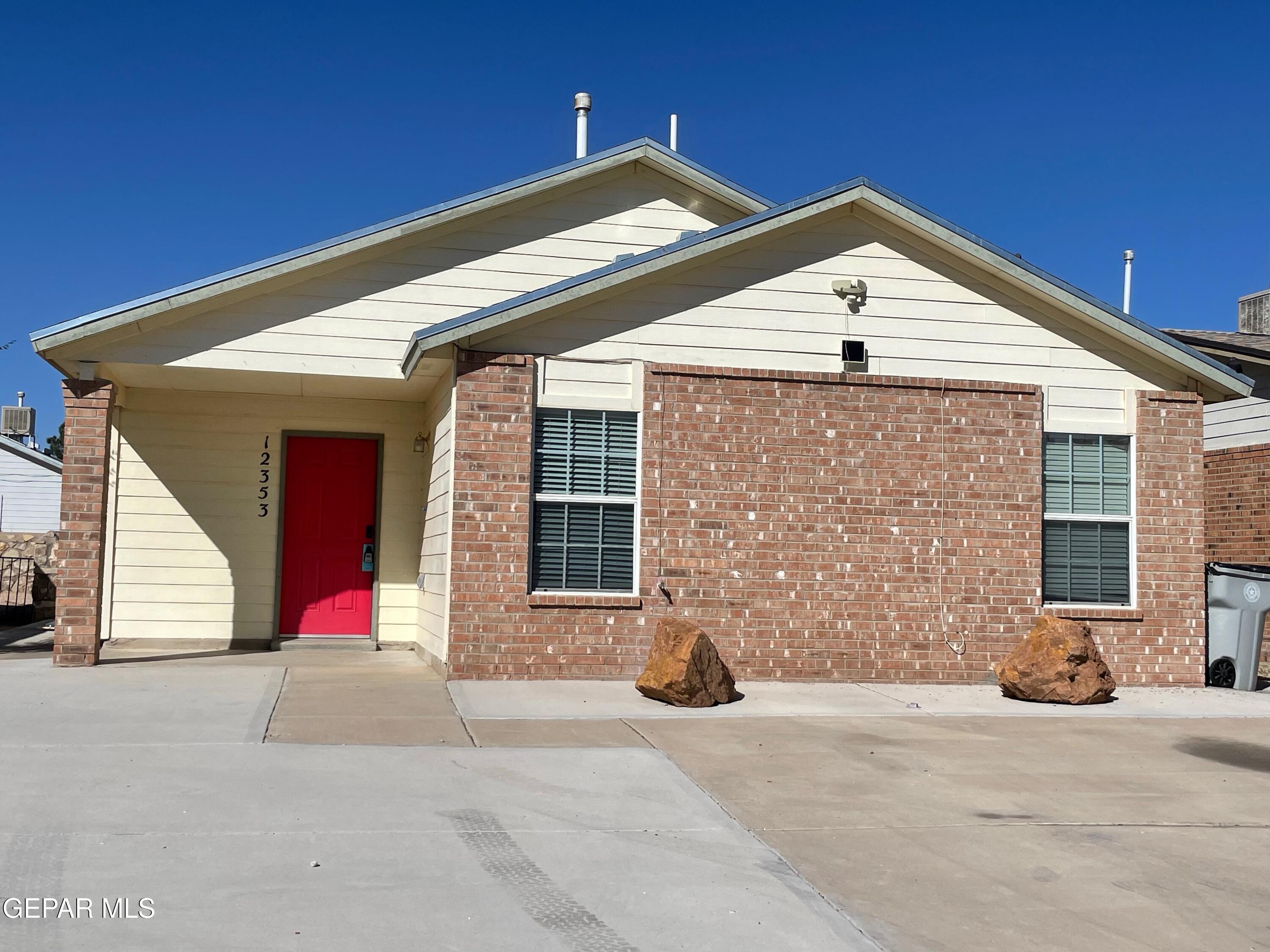 a front view of a house with an empty space