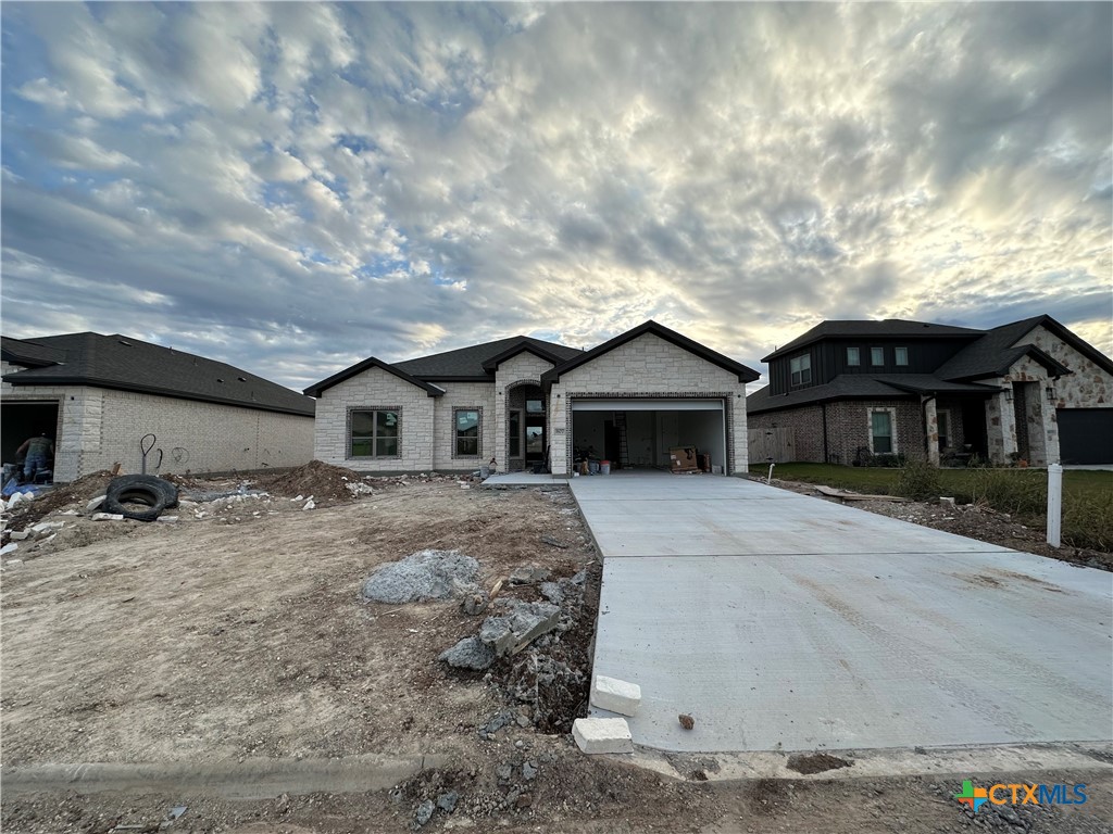 a front view of a house with yard